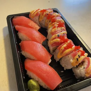 a close up of a tray of sushi