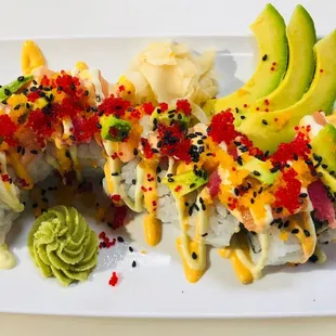 a plate of sushi and avocado
