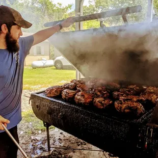 Pork butts on the front smoker, ribs in the back
