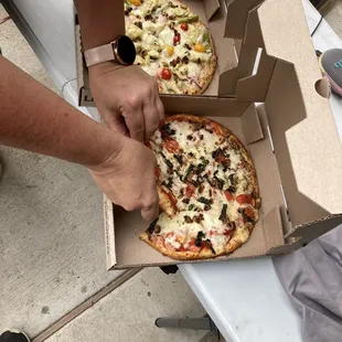 A Spring pizza and a Margarita pizza... delivered.