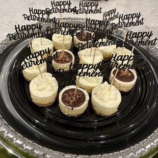 Key lime, chocolate peanut butter cup and classic mini cheesecakes. The "Happy Retirement" toppers are not included.