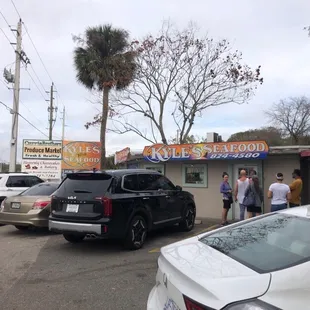 Small but mighty! Lots of locals waiting to pick up their seafood.