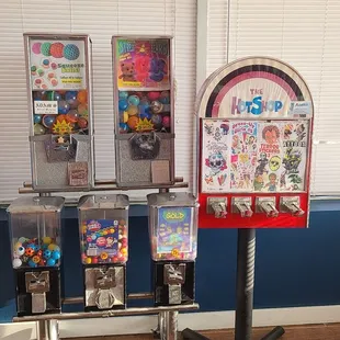 Old school candy and sticker dispensers