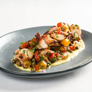 GRILLED OCTOPUS 
Roasted Peppers, Onions, Capers, Fava