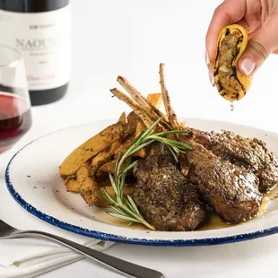 LAMB CHOPS 
Simply Grilled, Fresh Herbs, Roasted Lemon with Greek Fries