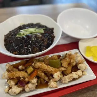 a plate of food on a red tray