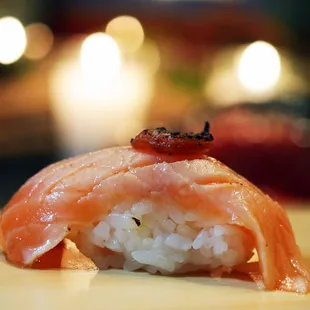 a close up of a piece of sushi