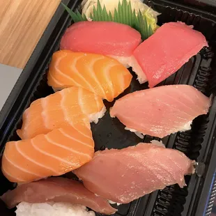 a tray of sushi and rice