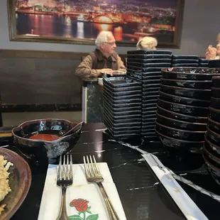 There was an array of plates and dishes that made me feel crowded and at some diner.