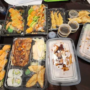 a variety of sushi dishes on a table