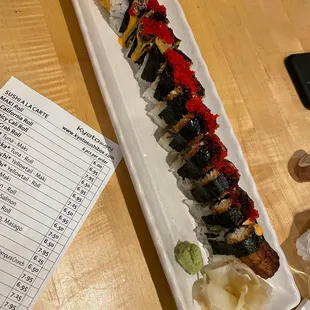 a sushi roll on a long plate