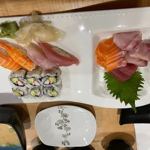 a variety of sushi on a white plate