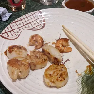 Perfectly cooked scallops and the extra two shrimp they throw in