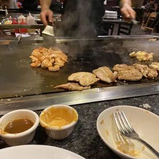 a man cooking on a grill