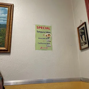 a woman sitting at a table in a restaurant