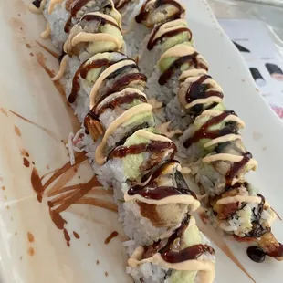 a sushi roll on a white plate