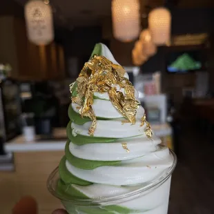 Frozen Premium Matcha swirl ice cream with gold leaf topping