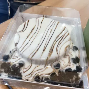a dessert in a plastic container