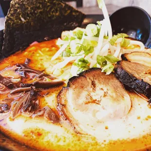 a bowl of ramen and a tortilla