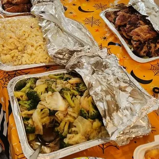 Rice, kalbi ribs, Mac salad, bbq chicken, curry chicken katsu, stir fry veggies, crab rangoons (white box)