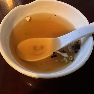 a bowl of soup with a spoon