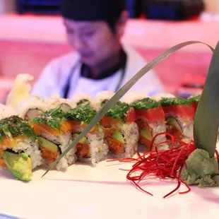 a man in a chef's hat in the background