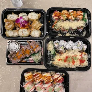 four trays of sushi