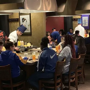 a group of people sitting at a table