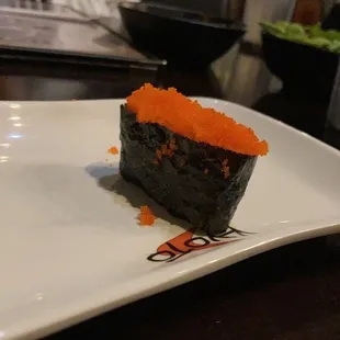 a piece of sushi on a plate