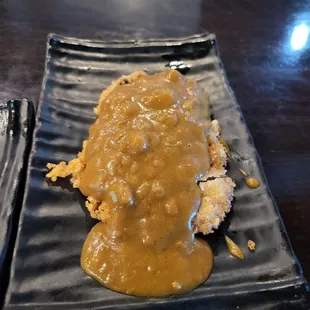 Curry cutlet but couldn't tell what meat it was. Pork or chicken.