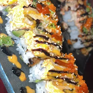 a close up of a long roll of sushi