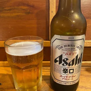 a glass of beer and a bottle of beer