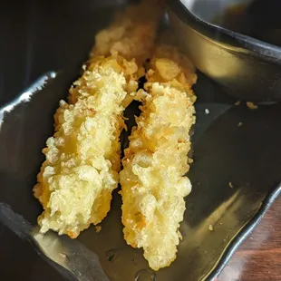 Shrimp tempura.  Comes in single pieces in All-You-Can-Eat but you can request more.