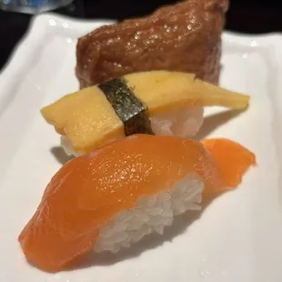 Inari tofu, egg tamago, and salmon nigiri.