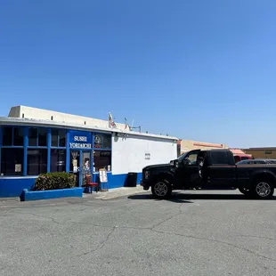  a truck parked in front of a store