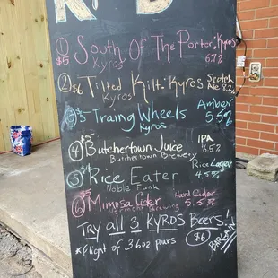 a blackboard with a list of beers
