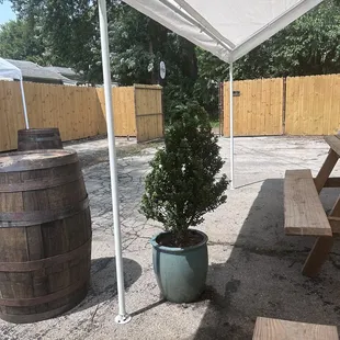 an outdoor patio area with tables and benches