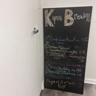 a blackboard with a list of beers