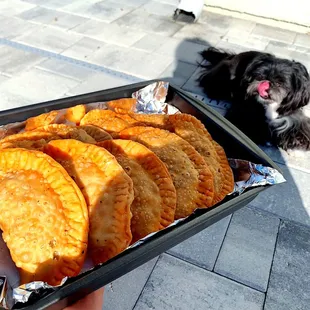 a person holding a tray of food