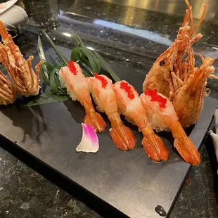 a plate of shrimp and shrimp skewers