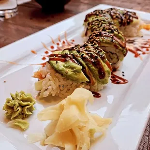 Caterpillar Roll - Shrimp tempura, cucumber, topped with avocado.