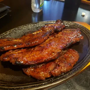 a plate of ribs on a table