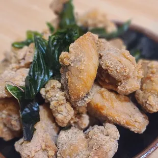 a plate of fried chicken and greens