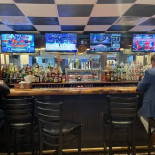  a man sitting at the bar