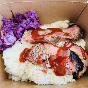  meat and rice in a cardboard box