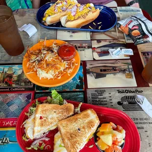 Our late lunch spread: vegan coney dogs, hash browns, and the Huntington sandwich
