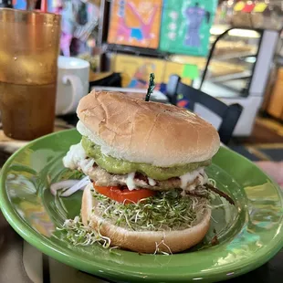 Turkey burger with sprouts and guacamole
