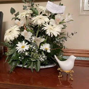 White floral funeral arrangement received that resembles the Heavens Gate arrangement.