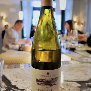 a bottle of wine on a table