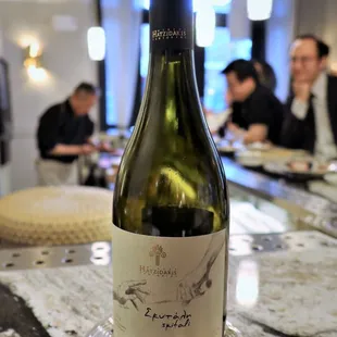 a bottle of wine on a plate